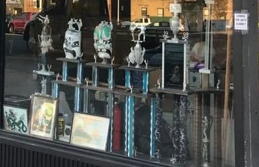 Trophies in the dojo window.